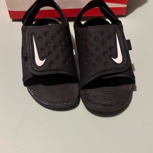 Toddler Nike slides.